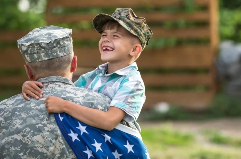 Soldier hugging child